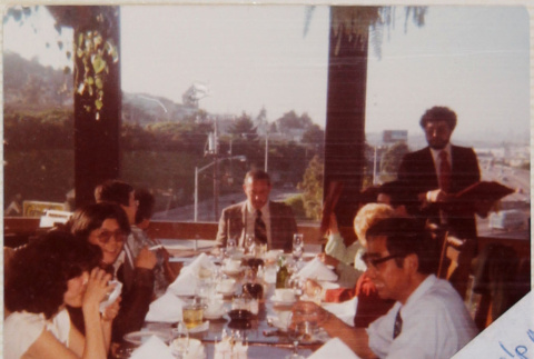 Group sitting at dinner table (ddr-densho-426-1308)