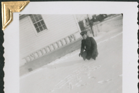 Man crouching in snow (ddr-densho-434-295)