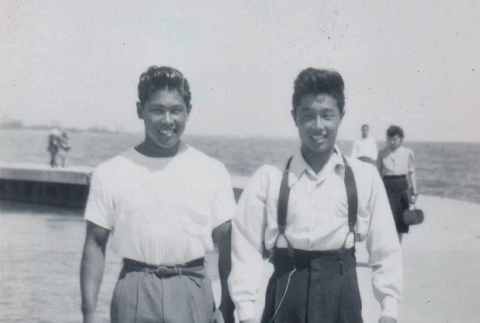 Two young men at Huntington Beach (ddr-densho-513-6)