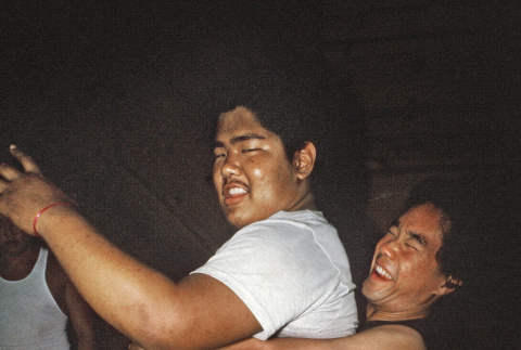 Nate Takarabe and Craig Uyesugi during casino night (ddr-densho-336-1815)