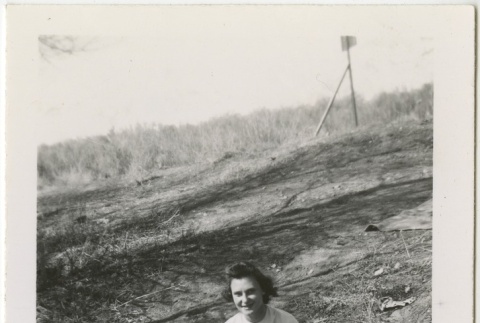 Woman sitting next to a stream (ddr-manz-7-98)