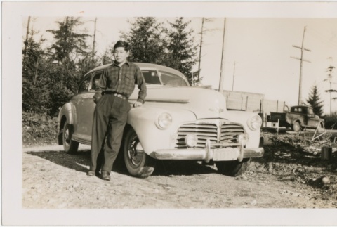 Masao Yamashita standing next to his Chevrolet (ddr-densho-296-195)