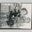 Family picture exposed over photo of mother holding child (ddr-densho-523-73)