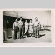 Tsukada Siblings standing outside barracks at Amache (ddr-densho-356-1074)