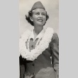 A woman in uniform wearing a lei (ddr-njpa-1-1268)