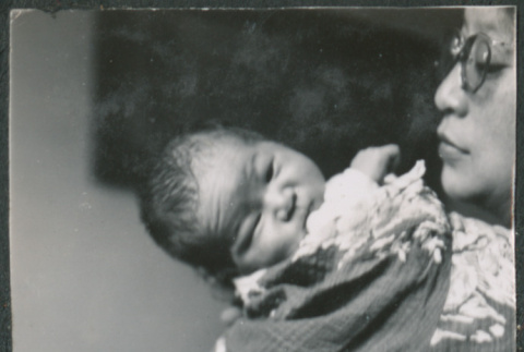 Woman holding a baby (ddr-densho-523-53)