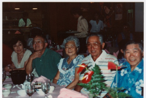 Group including Bill and Tomi Iino at meal (ddr-densho-368-413)