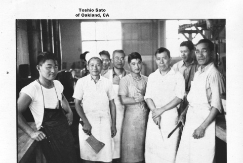 Group of cooks inside camp kitchen (ddr-ajah-6-225)