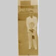 Amado Sanchez[?] standing on a tennis court (ddr-njpa-1-1790)