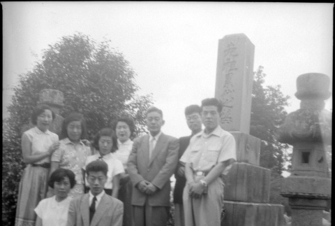 Group standing by stones in cemetery (ddr-densho-426-2473)