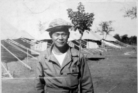Serviceperson outside tents (ddr-densho-1007-61)