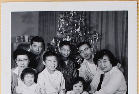Shiomi family with other family by Christmas tree (ddr-densho-522-526)