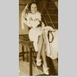 A woman posing on a ship with leis (ddr-njpa-1-811)