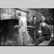 Two women and three men standing by large outside fireplace (ddr-densho-426-1966)