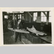 Mr. Martin holds a model hull (ddr-densho-37-1354)