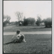 Woman with dog on lawn (ddr-densho-523-327)