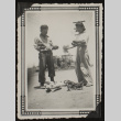 Kay and Mits holding pigeons (ddr-densho-542-369)