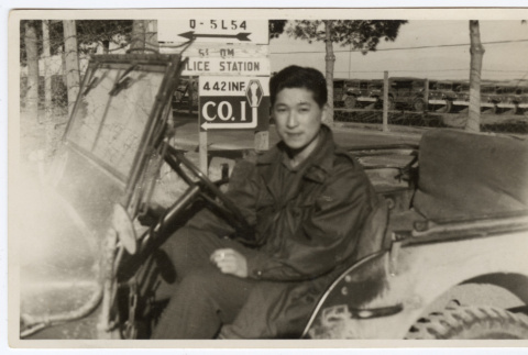 Makoto Mimaki driving a military vehicle (ddr-densho-451-57)