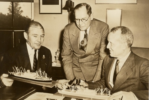 Lewis W. Douglas, Howard L. Vickery, and Emory S. Land reviewing ship models (ddr-njpa-1-183)