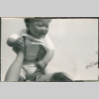 Baby being held up in the air (ddr-densho-523-113)