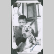 Photo of Paul Ima with a dog and a man in the background (ddr-densho-483-1331)