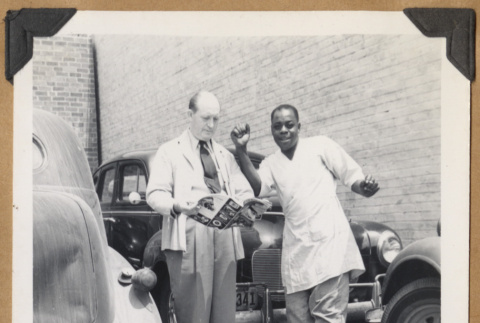Two men outside a building (ddr-densho-542-104)