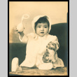 Baby holding rattle (ddr-csujad-55-1311)