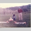 George Kida at family gravestones (ddr-one-3-96)