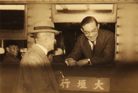 Asahi Shimbun writer speaking to another man (ddr-njpa-4-688)