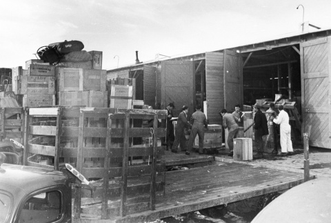 Unloading freight at camp warehouse (ddr-densho-37-122)