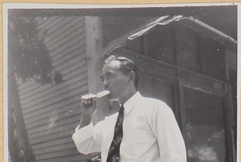 Man with ice pop, with boy (ddr-densho-522-8)
