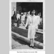 Mary Kondo standing outside building with group in background (ddr-ajah-6-111)