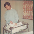 Man with baby in hospital (ddr-densho-523-481)