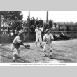 Three men in baseball uniforms at home plate (ddr-ajah-5-72)