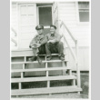 Officer and one other on stoop (ddr-densho-1007-603)