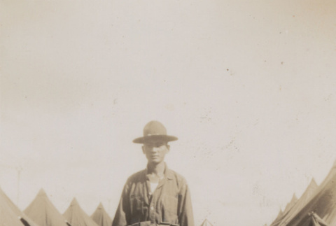 Man standind in middle of dirt road (ddr-janm-17-60)