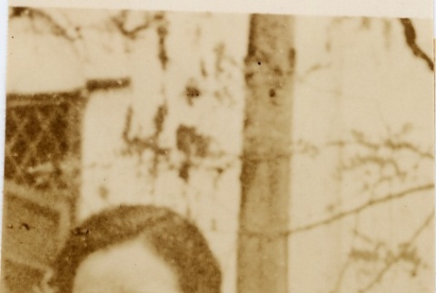 A woman standing outside (ddr-njpa-1-1718)