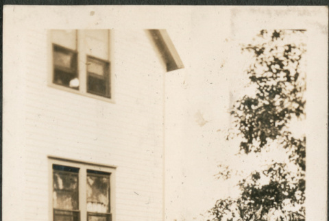 Girl in garden outside house (ddr-densho-293-44)