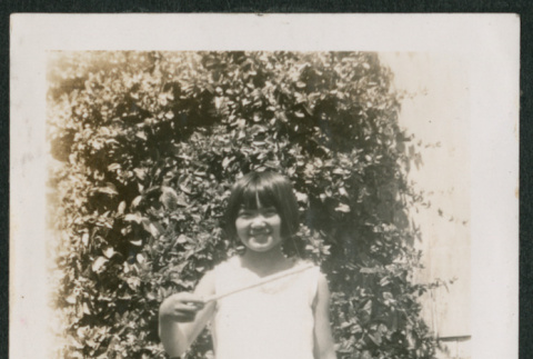 girl in yard (ddr-densho-378-306)