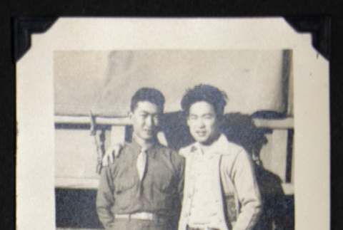 Leo and Gary by a military truck (ddr-densho-542-636)