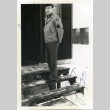 Soldier standing on steps (ddr-densho-22-404)