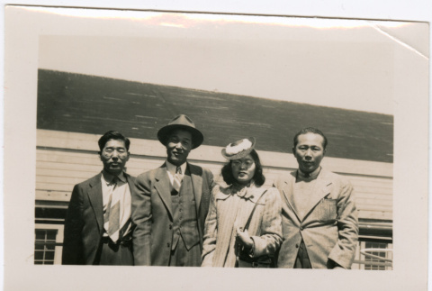 Henri Takahashi on right, with Tomoye (Nozawa) Takahashi and two unknown men on board ship (ddr-densho-426-1991)