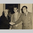 Wilfred C. Tsukiyama posing with two men (ddr-njpa-2-878)