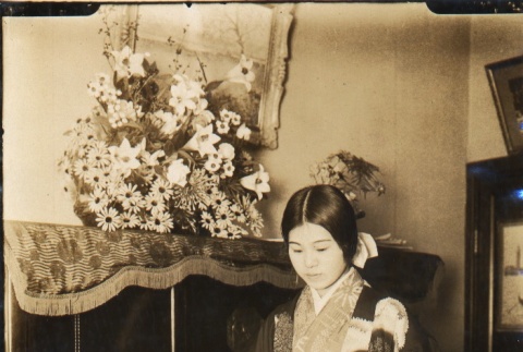 Girl in kimono reading sheet music (ddr-njpa-4-195)