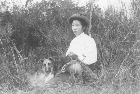 Woman with her dog (ddr-densho-102-7)