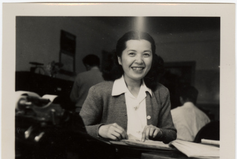 Woman seated at desk (ddr-densho-426-943)