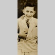 A boy smiling in a suit (ddr-njpa-1-266)