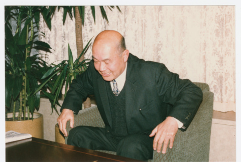 Hugh Nozawa in chair (ddr-densho-1007-407)