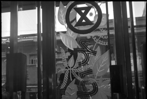 Sign on door of business (ddr-densho-426-297)