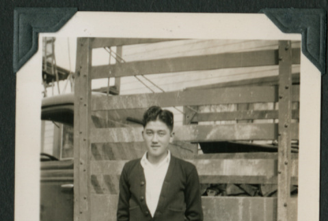 Man poses in front of truck (ddr-densho-359-1062)